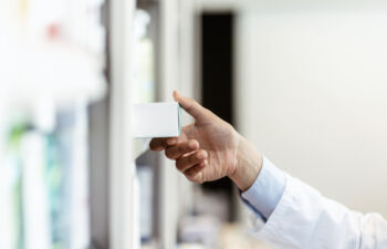 Hand-selecting-medicine-from-shelf