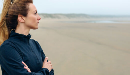 Getty Images-1086585978-woman-looking-out-to-sea
