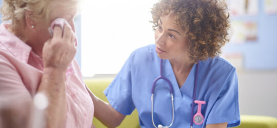 Getty Images-623438206-health-professional-comforting-patient