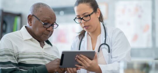 Getty Images-1293814791-doctor-and-patient-resize