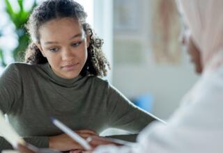 Getty Images-1350731630-young-person-with-doctor-cropped